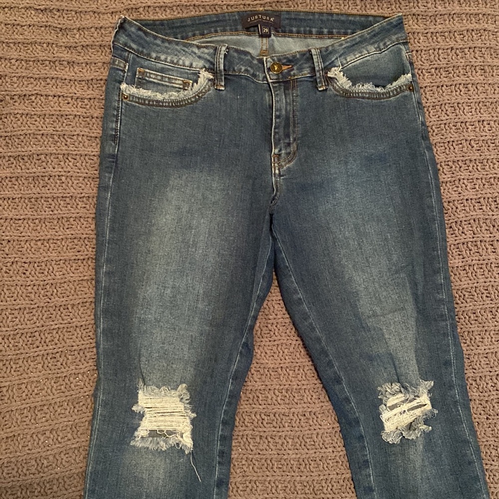 Distressed mid rise jeans